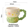 Beaded Lemon ceramic mug with hand-painted relief flowers and wheel-shaped base, 420ml - Beaded Lemon