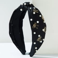 Diadema de tela negra con nudo, perlas blancas y adornos de lazos dorados - Negro