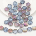 Detailed macro of iridescent spiral glass beads for DIY jewelry and crafts - Semi-transparent Purple