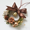 Mini Christmas wreath featuring pine cones, gold bells, and a brown satin ribbon bow - Brown Bow Wreath 13cm