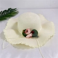 Detail of cream straw sun hat featuring wavy brim and floral rose decoration - Adult M / Creamy White