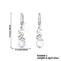 Silver spiral drop earrings with white zircon stones measuring 3.7cm long and 0.7cm wide - Silver