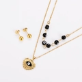 Detailed view of gold evil eye heart pendant necklace with matching stud earrings - Gold (Black Eye)
