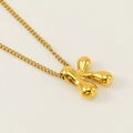 Polished gold bubble letter K pendant necklace on a matching chain for women - Letter K