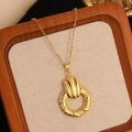 Detail of vintage 18K gold plated necklace with spiral ring and pleated fan pendant - Gold Spiral Shell Pleated Necklace