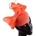 Elegant orange mesh fascinator hat with oversized bow on a model for formal banquets - Coral