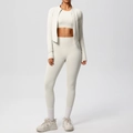 Three-piece ivory yoga set including zip jacket, crop top, and high waist leggings detail - Light Ivory
