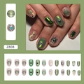 Press-on nail set in gradient green cat-eye finish with silver lines and heart accents - Z808 Starburst Heart