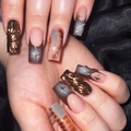 3D star pattern press-on nails in deep grey-blue and brown snake skin texture - Bronze Metallic Starburst Relief (DS35)
