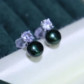 Elegant dark green pearl stud earrings with sparkling cubic zirconia on silver setting - Dark Green