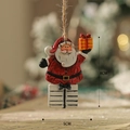 Hanging resin Santa Claus ornament with gift box for Christmas tree decor, 8cm height - Santa Claus
