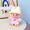 Labubu plush doll wearing pink and white clothes with yellow hat and checkered scarf - Newborn Baby Powder / First And Second Generation Keychains Are Compatible With La Cloth Dolls. Dolls Not Included.