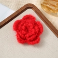 Macro detail of a 7cm red triple-layered handmade crochet flower for garment accessories - 7cm / Mohair Red