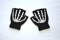 Detail of black fingerless knit gloves featuring white skeleton hand bone prints for teens - Skeleton Claw / Half Finger
