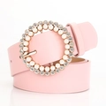 Pink faux leather belt for women featuring a round pearl and rhinestone encrusted buckle - Pink