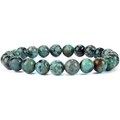 Macro detail of turquoise beads with natural mineral veins on a white background - Turquoise Bracelet 8mm