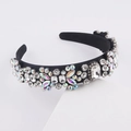 Macro shot of luxury baroque headband featuring multi-shape crystals on black velvet - H White