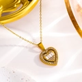 Luxury gold heart pendant necklace featuring sparkling zircons on a white stone background - Gold Heart / 18K Gold Plated