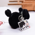 Fluffy black cat plush keychain featuring a vibrating pull-cord and a silver bell - Wagging Tail Style / Black
