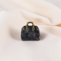 Miniature handbag pendant crafted from spotted grey natural stone with gold handle - Larvikite