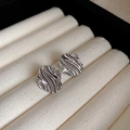 Macro shot of silver-colored twisted earrings with liquid-metal texture on beige velvet - 15# Silver Earring Post - Silver - Water Ripple