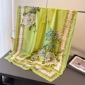 Elegant green floral silk scarf with peony print and vintage gold border on a display - Grass Green (XD14-1)
