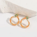 Detail of snake hoop earrings with orange enamel, gold trim and green gemstone eyes - Orange