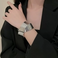 Detail of silver multi-layer metal cuff bracelet with high-polish finish on model - Silver Geometric Intertwined Overlay Style (D1482)