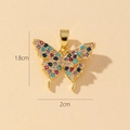 Macro detail of gold butterfly pendant with colorful zircons, size 1.8cm by 2cm - T-Small Colorful Butterfly (1.8x2cm)