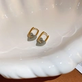 Elegant gold hoop earrings with polished gray heart pendants in a decorative shell dish - Gold Ring Gray Enamel Heart Style (155#)