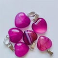Set of 6 magenta heart-shaped agate pendants with silver metal clasps on white background - Purple Agate