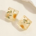 Close-up of square resin earrings with embedded yellow dried flowers and gold foil - ES2388-4 Square Dried Flower Resin Earrings