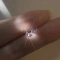 Minimalist S999 silver stud earrings featuring small round white zirconia stones - Light Purple