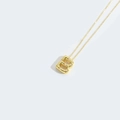 Elegant gold necklace featuring a letter B pendant inlaid with small white pearls - Letter B