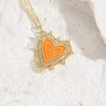 Golden heart necklace featuring vibrant orange enamel inlay and sparkling zircon accents - Orange