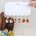 Three pairs of Christmas earrings featuring Santa hat, candy cane and bell charms - Style 10 (3 Pairs Set)