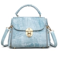 Chic light blue textured handbag for women with gold clasp and twisted top handle strap - Fabric Pattern Blue