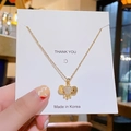 Gouden olifant hanger ketting van titanium staal met kristallen op een kaartje - Gouden Olifant