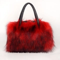Detail of red and black fluffy faux fur texture with premium black leather handles - Red