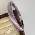 Detail view of thickened lavender satin headband on a premium wooden jewelry display tray - Taro Purple