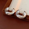Macro detail of silver C-shaped earrings with irregular lava texture and high mirror finish - 13# Silver Needle-Silver Liquid Lava C-Shape