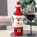 Knitted Santa Claus wine bottle cover with white beard and festive belt decoration - Santa Claus