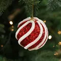 8cm red and white spiral glitter Christmas ball ornament hanging on a festive tree branch - Diagonal Stripe Foam Ball Style C