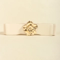 Detailed view of women's elastic wide belt with a large golden floral metal buckle - Beige