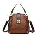 Vintage brown pebbled leather bucket bag with gold hardware and V-shaped stitching detail - Brown