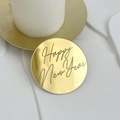 Macro view of golden Happy New Year acrylic cake topper sign with reflective finish - Round Happy New Year Style 1 / Gold