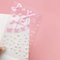 Pink ribbon bow face stickers with holographic crystals for fairy stage makeup looks - Pink Bow Rhinestones (BJA-652)