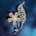 Rose gold camellia flower brooch with pearls and rhinestones on dark fabric - Flower Brooch