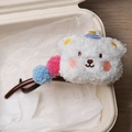 Winter plush white bear hair claw with blue party hat and colorful pom-poms accent - White Bear Twist Clip
