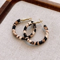 Detailed view of leopard print hoop earrings with textured fabric on a wooden tray - 3cm Leopard Fabric Hoop / Beige Coffee 3cm (24# Silver Needle)